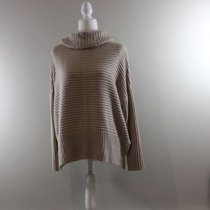 Tan turtleneck sweater from Joan Vass New York